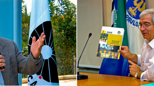 Montagem com duas fotos lado a lado. À esquerda, um homem idoso de cabelos grisalhos, usando óculos, terno xadrez e gravata azul segura um microfone enquanto fala, gesticulando com a mão esquerda. Ao fundo, há uma bandeira com símbolo circular em preto e branco e árvores. À direita, o mesmo homem, agora usando camisa social branca com listras, está sentado em uma mesa de madeira, segurando e mostrando um documento com o título “Proposta de Distribuição Orçamentária 2009”. Atrás dele, há bandeiras e parte do logotipo da Unicamp projetado na parede.